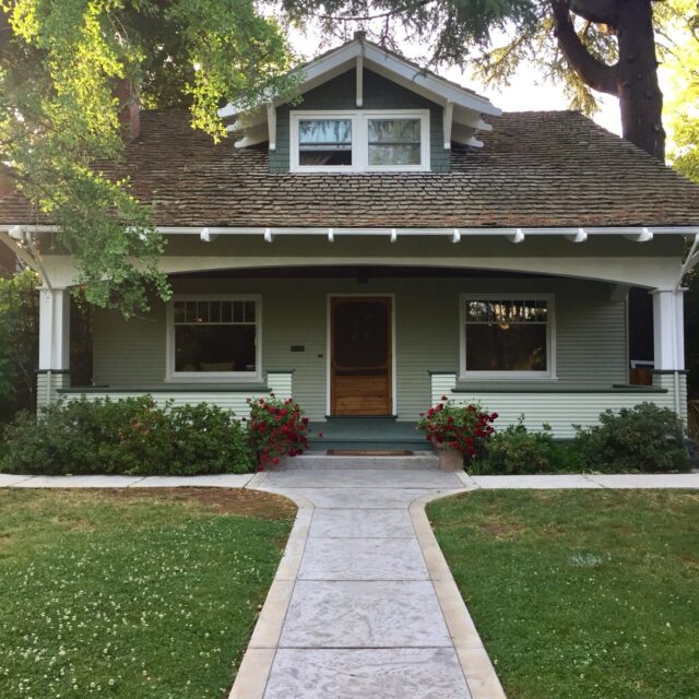 Exterior house painting in Sacramento, CA by Baldwin Custom Painting — green craftsman bungalow with front porch