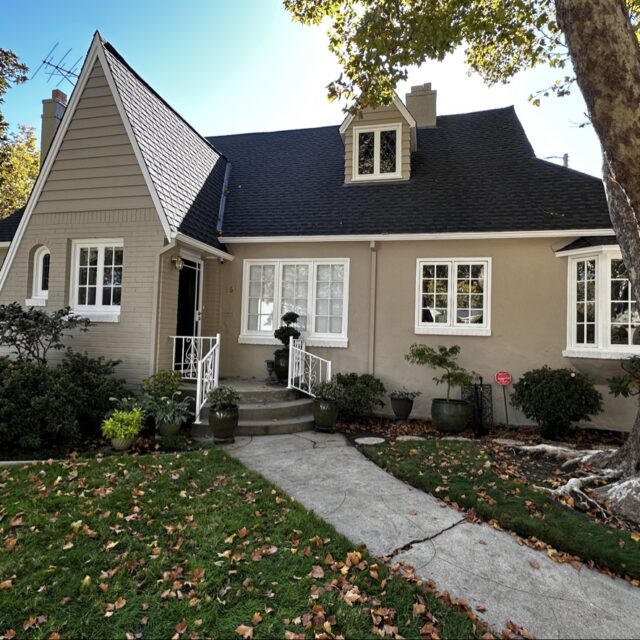 Exterior house painting in Sacramento, CA by Baldwin Custom Painting — brick ranch home with white trim and front porch