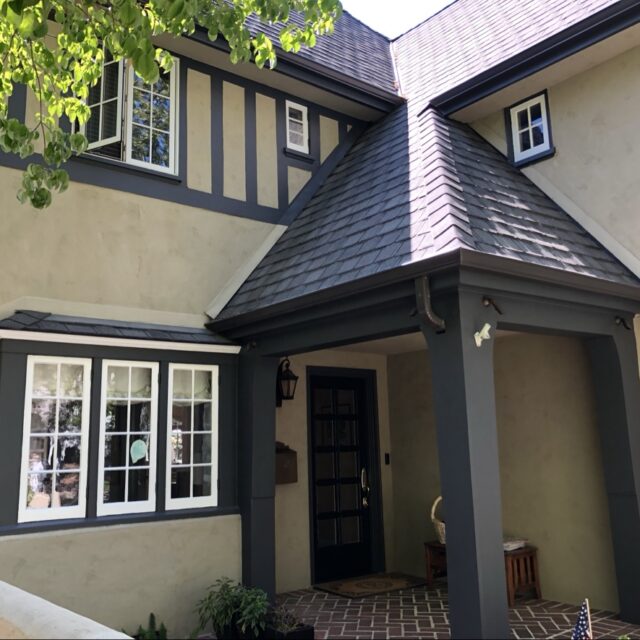 Exterior house painting in Sacramento, CA by Baldwin Custom Painting — Tudor-style home with dark timbering and cream stucco