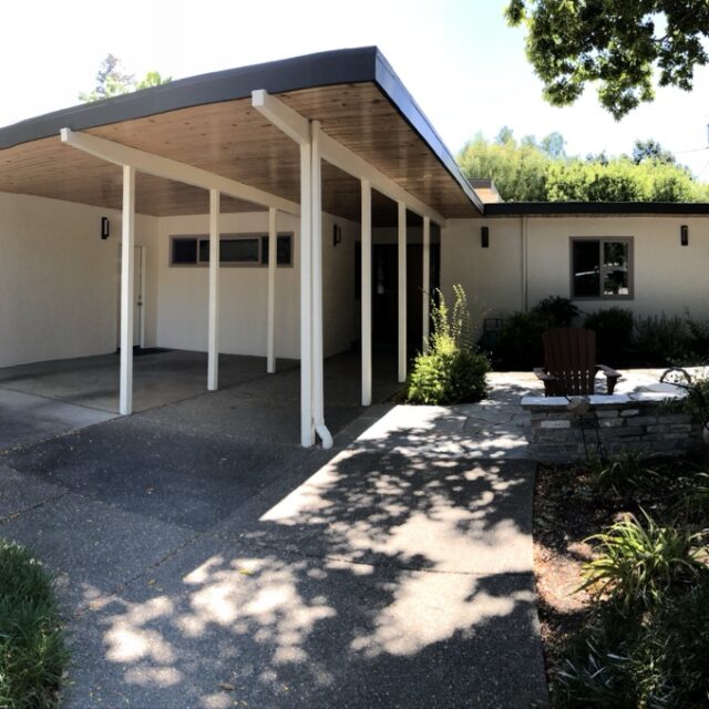 Exterior house painting in Sacramento, CA by Baldwin Custom Painting — mid-century modern patio cover with white posts