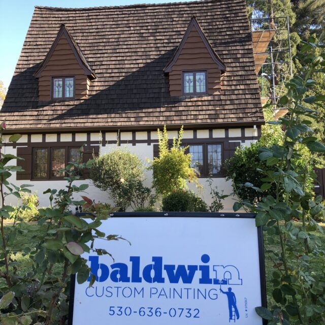 Exterior house painting in Sacramento, CA by Baldwin Custom Painting — brown shingle home with white trim