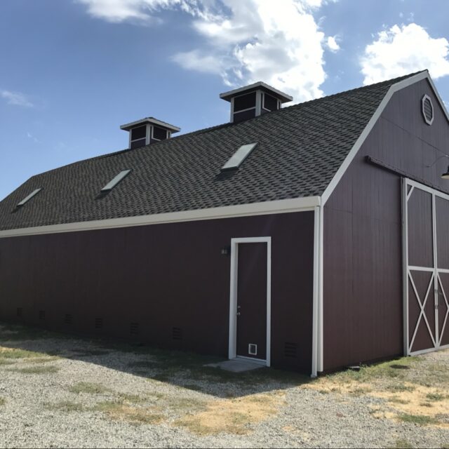 Exterior house painting in Sacramento, CA by Baldwin Custom Painting — dark brown barn-style garage