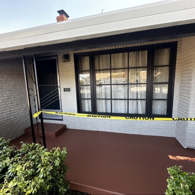 Exterior house painting in Sacramento, CA by Baldwin Custom Painting — front porch with black-framed windows and white columns