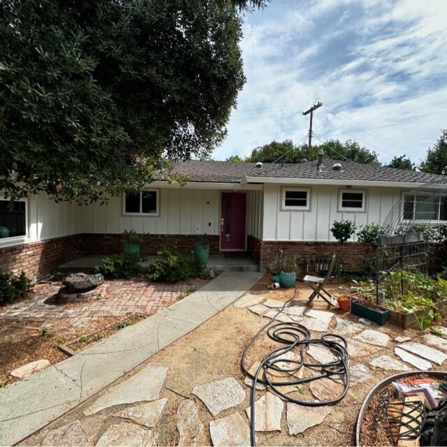 Exterior house painting in Sacramento, CA by Baldwin Custom Painting — white ranch home shaded by mature tree
