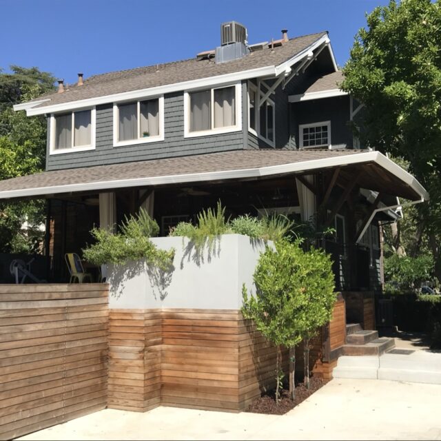 Exterior house painting in Sacramento, CA by Baldwin Custom Painting — gray-blue two-story craftsman with white trim and porch