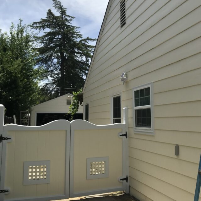 Exterior house painting in Sacramento, CA by Baldwin Custom Painting — beige horizontal siding with white trim