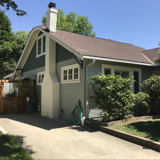 Exterior house painting in Sacramento, CA by Baldwin Custom Painting — olive green two-story craftsman with brown roof