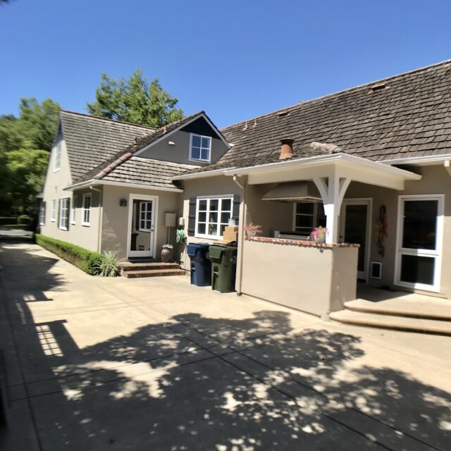 Exterior house painting in Sacramento, CA by Baldwin Custom Painting — beige ranch home with brown roof and front lawn