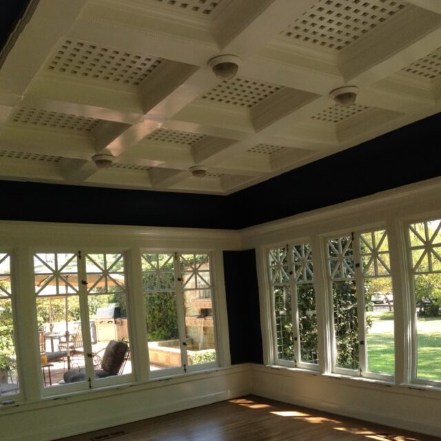 Interior house painting in Sacramento, CA by Baldwin Custom Painting — coffered ceiling detail with decorative crown molding and white lattice panels