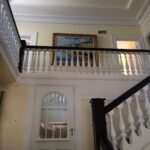 Historic dining room with sage green walls and white trim