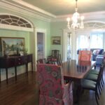 Living room with light blue walls and white crown molding