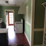 Upstairs landing with white balusters and dark handrail