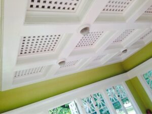 Interior house painting in Sacramento, CA by Baldwin Custom Painting — white coffered ceiling with lattice detail and green walls