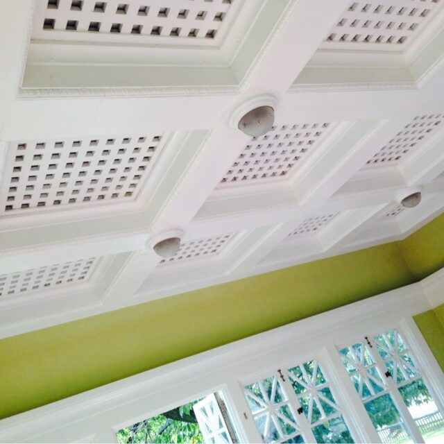 Interior house painting in Sacramento, CA by Baldwin Custom Painting — white coffered ceiling with lattice detail and green walls
