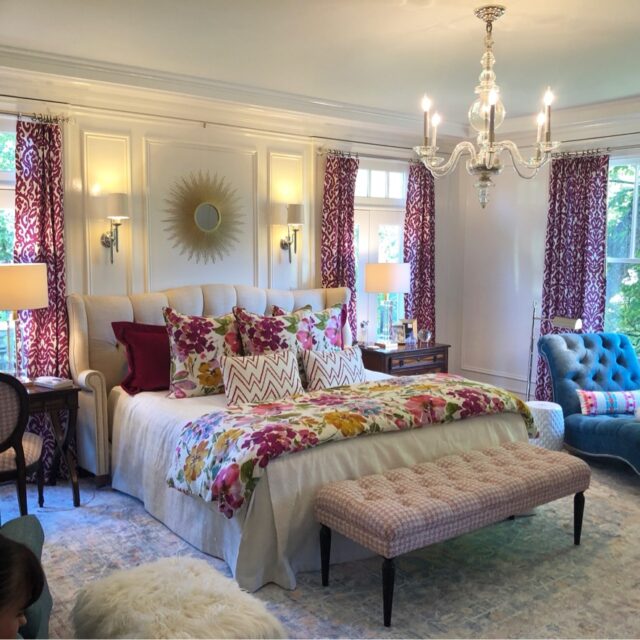 Interior house painting in Sacramento, CA by Baldwin Custom Painting — elegant bedroom with chandelier and floral bedding