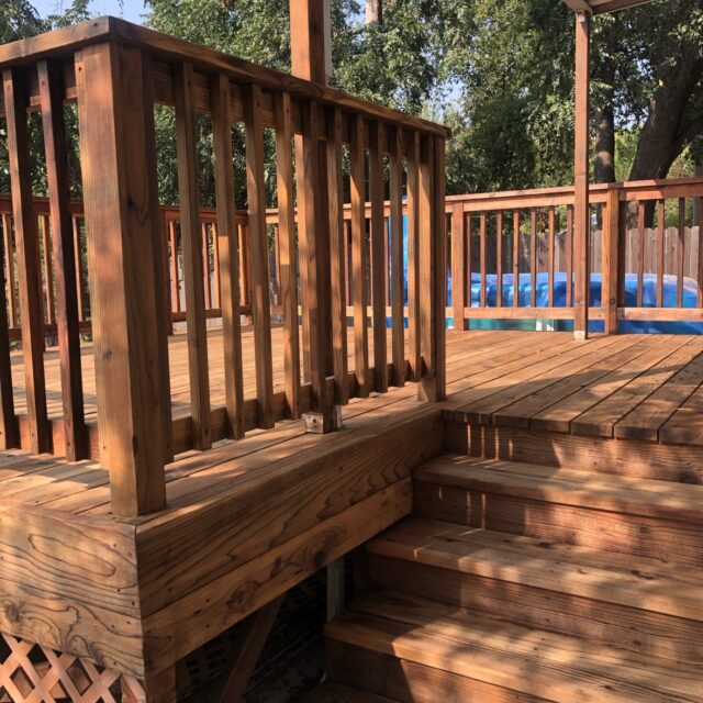 Wood staining in Sacramento, CA by Baldwin Custom Painting — freshly stained wood deck with railings