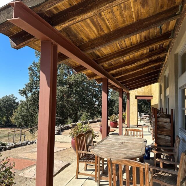Wood staining in Sacramento, CA by Baldwin Custom Painting — rustic patio with stained wood beam ceiling